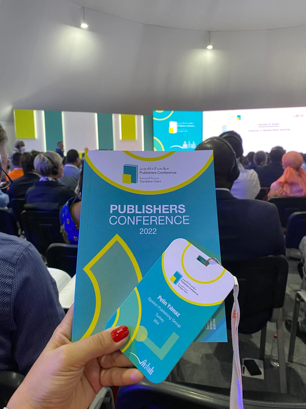 Programme and delegate badge at the Publishers Conference, 2022